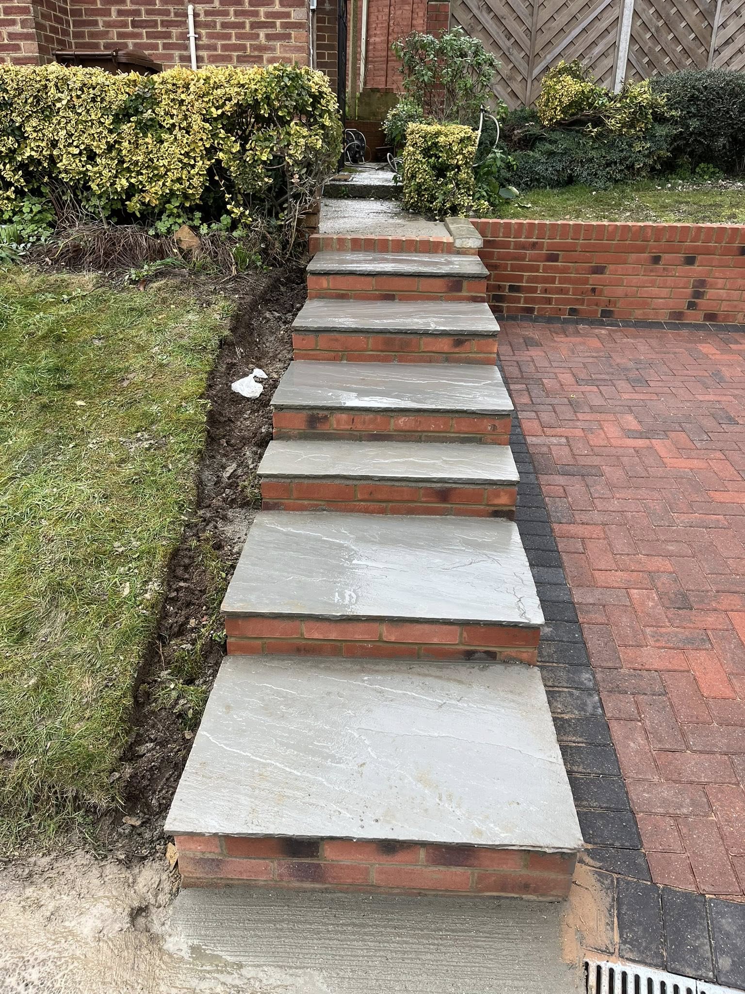 Kandler grey sandstone steps with red stock brick risers for driveway in Maidstone