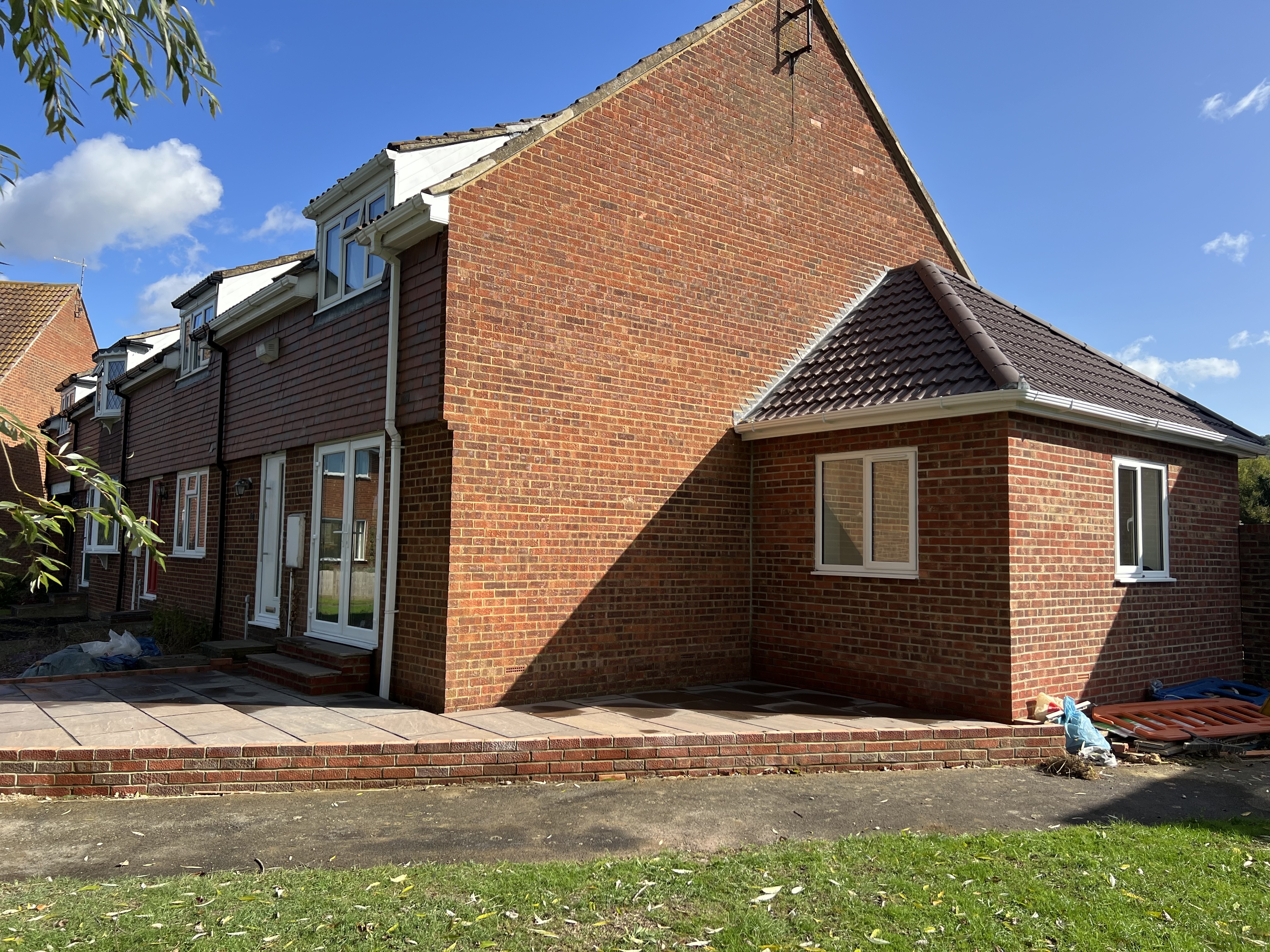 Red Brick Side Extension with Modern Patio