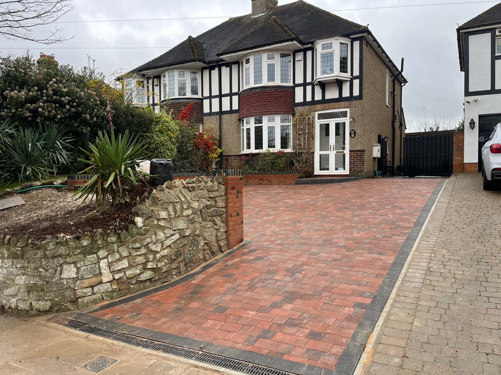 Red Brick Driveway Rochester - Sloped Driveway with Retaining Wall & Integrated Drainage
